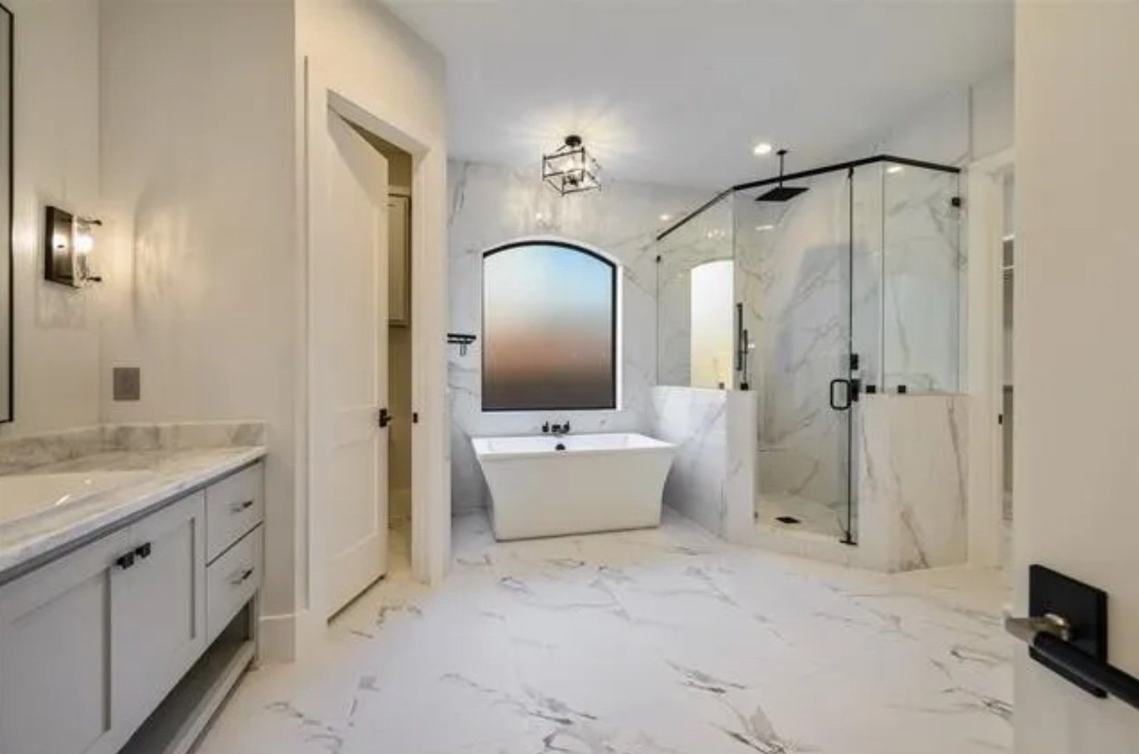 Marble spa bathroom with freestanding tub